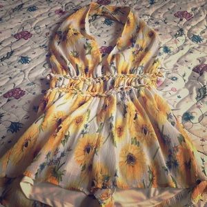 Sunflower romper by fashion nova.